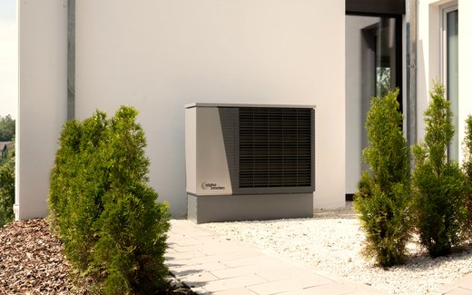 A newly installed outdoor unit beside a house.